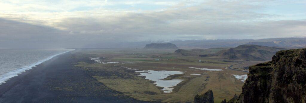 Black sand beach and mountains