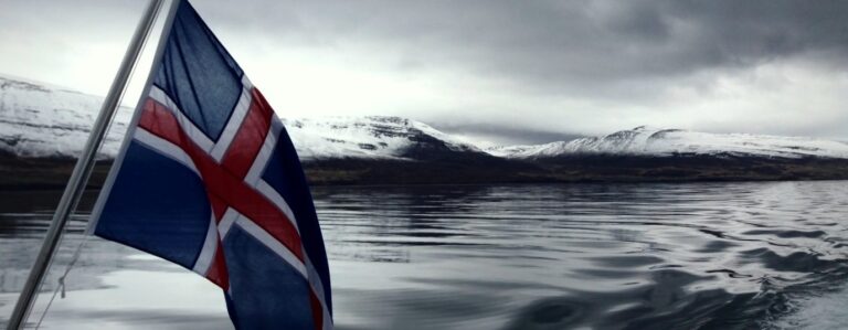 icelandic flag with ocean background