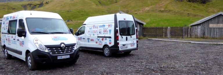 two rent.is camper vans parked in a parkinglot