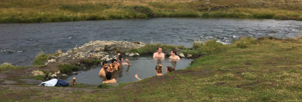 people sitting in a hot spring