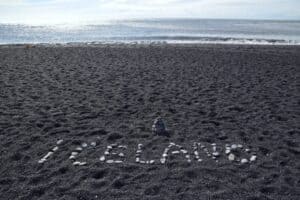 Iceland, written on black beach