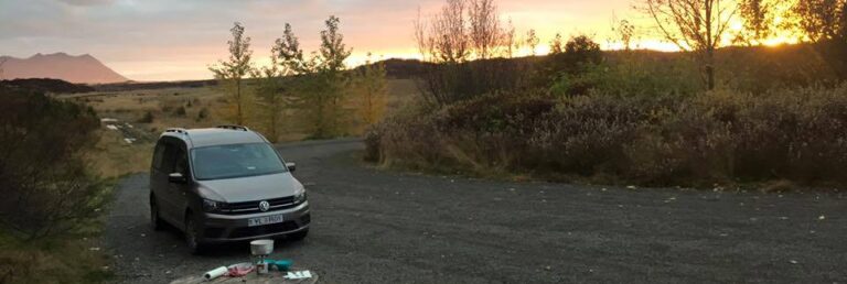 rent.is campervan at a campsite in the fall