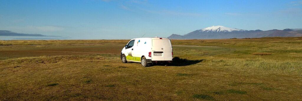 rent.is camper van parked in a field in iceland