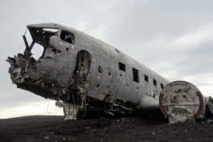 The DC-3 plane on black sand
