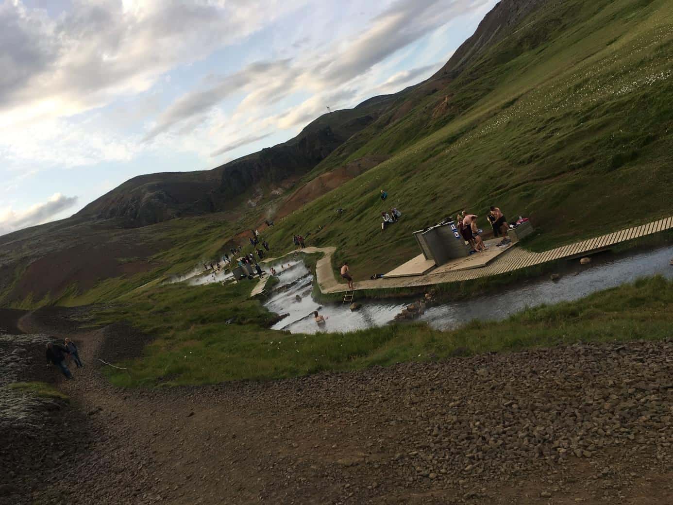 people enjoying a hot spring river