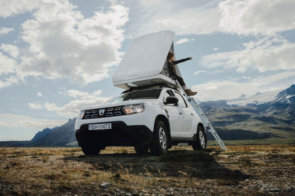 4x4 Dacia Duster camper van with rooftop tent and stairs