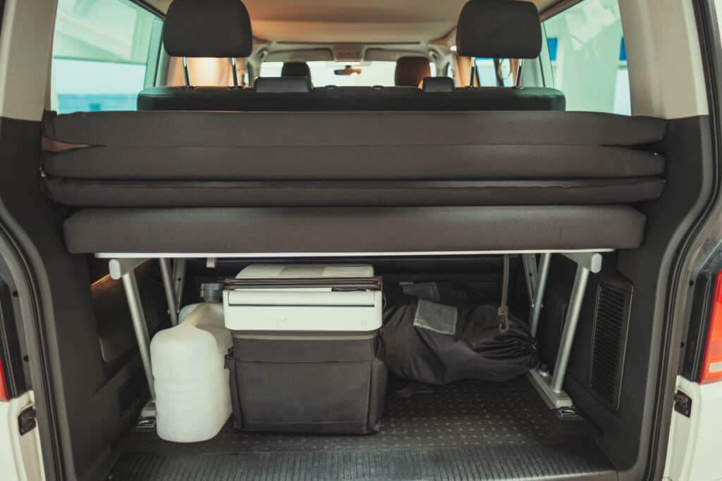 VW California 4×4 camper interior storage space with water tank