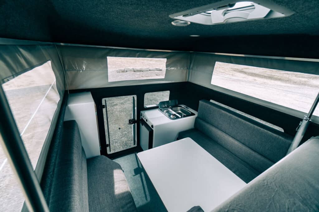 Toyota Hilux 4×4 Campervan interior table and benches