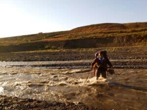 River crossing while hiking in Iceland River crossing while hiking in Iceland