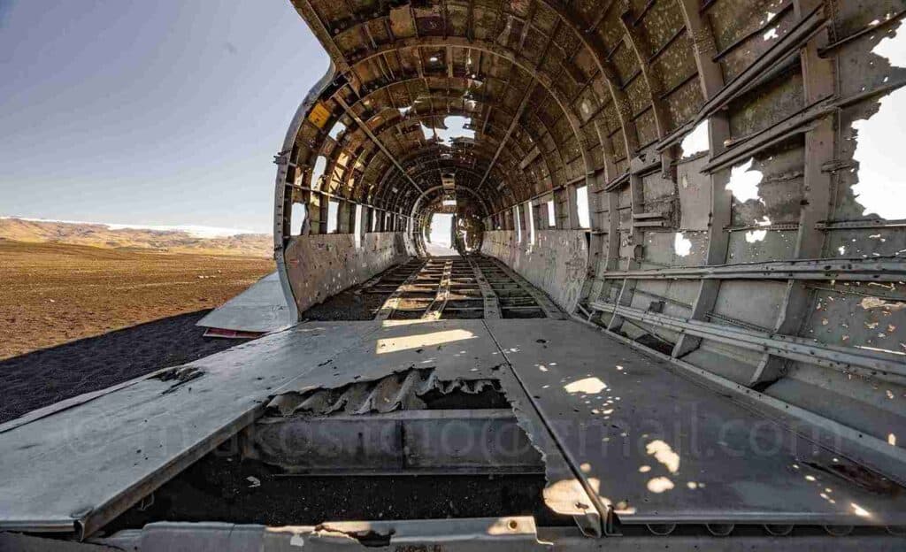 Inside an old plane wreck, cleared out.