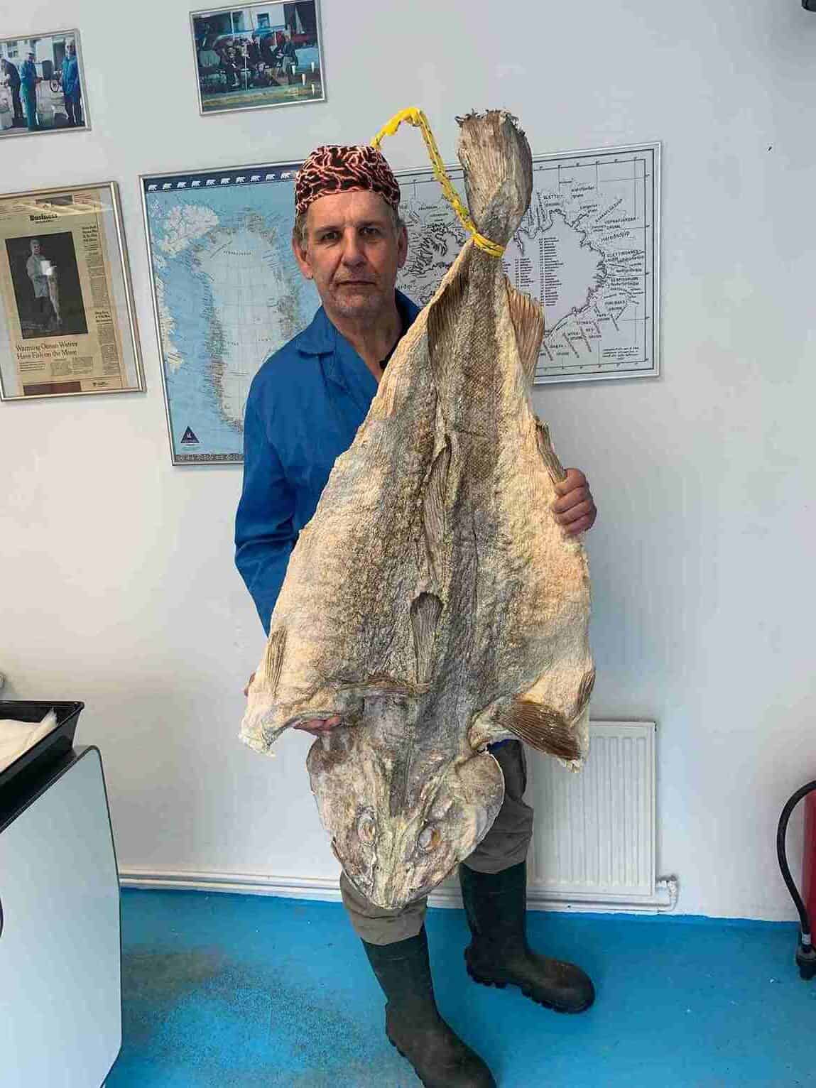 man holding salted cod