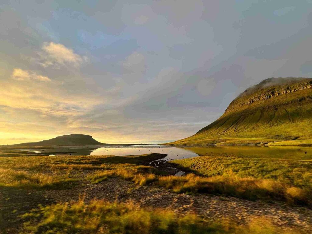 A peaceful lake by some mountains