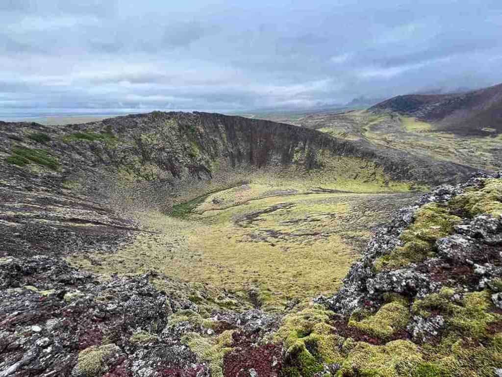 A grassy crater