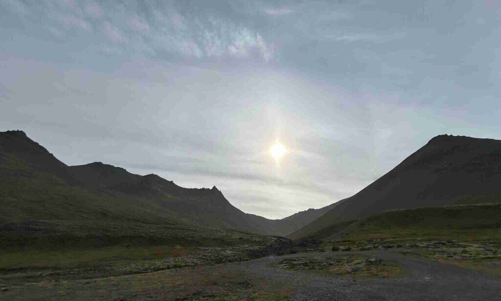 The sun in-between two mountains