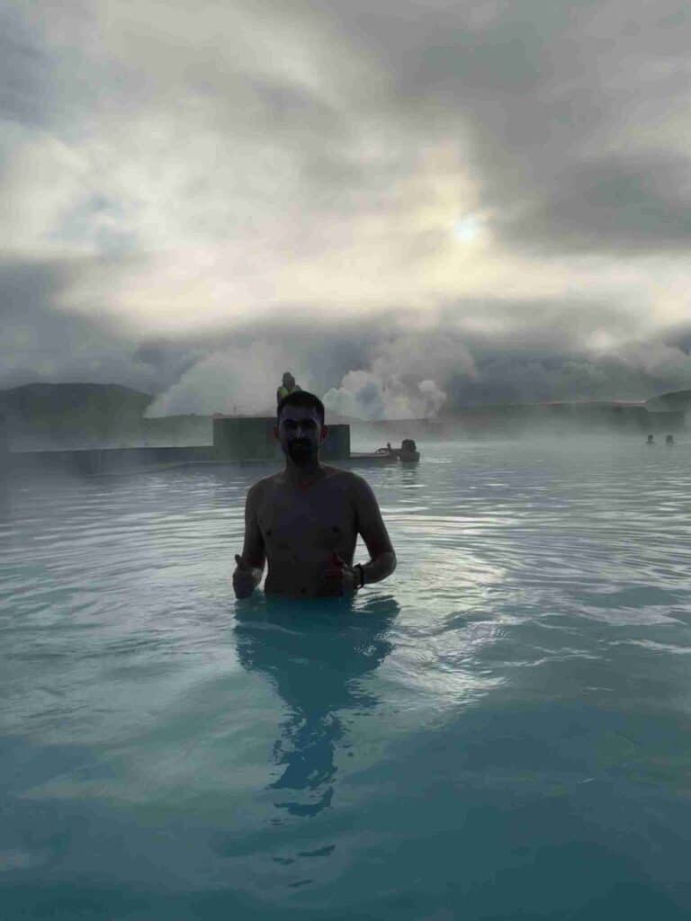 A man standing in the blue lagoon
