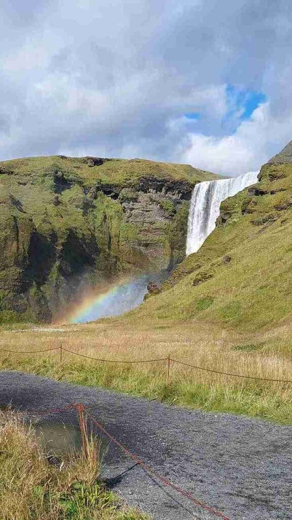 Skógarfoss waterfall and small rainbow