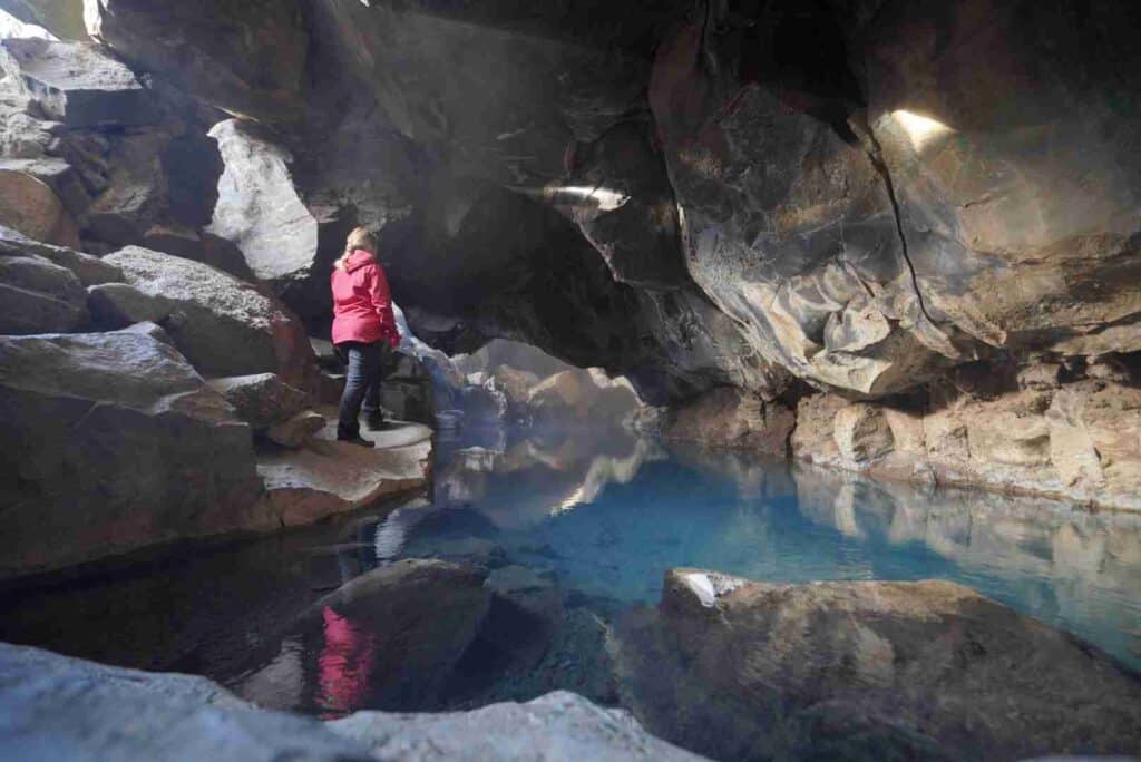 A cave with blue water