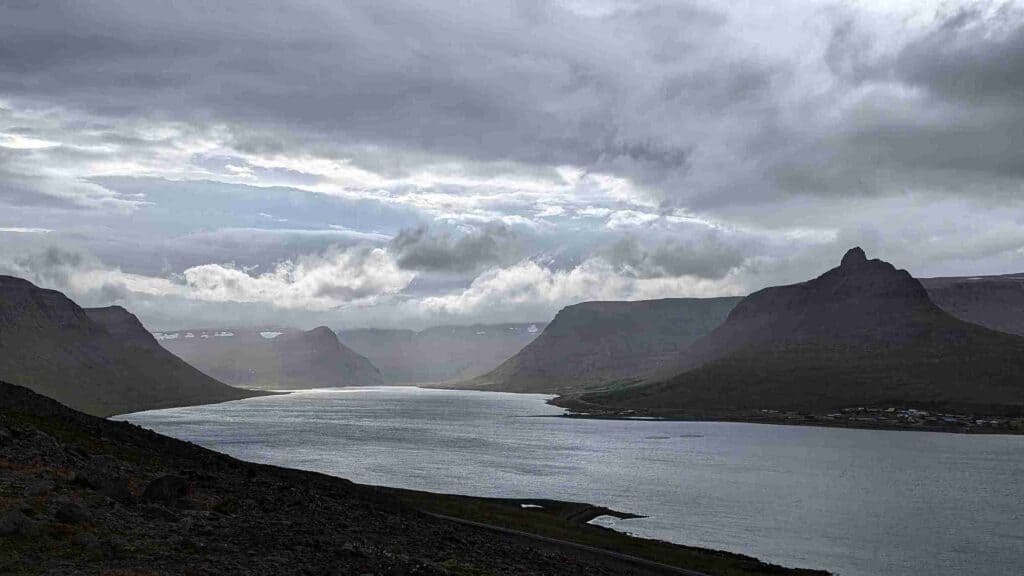 A fjord with blue and gray skies