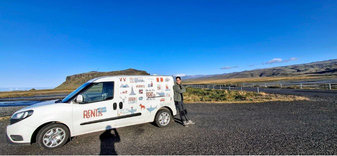A man standing with the fiat doblo campervan 
