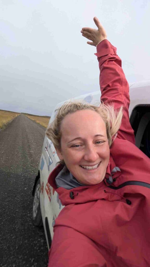 A woman outside a car window