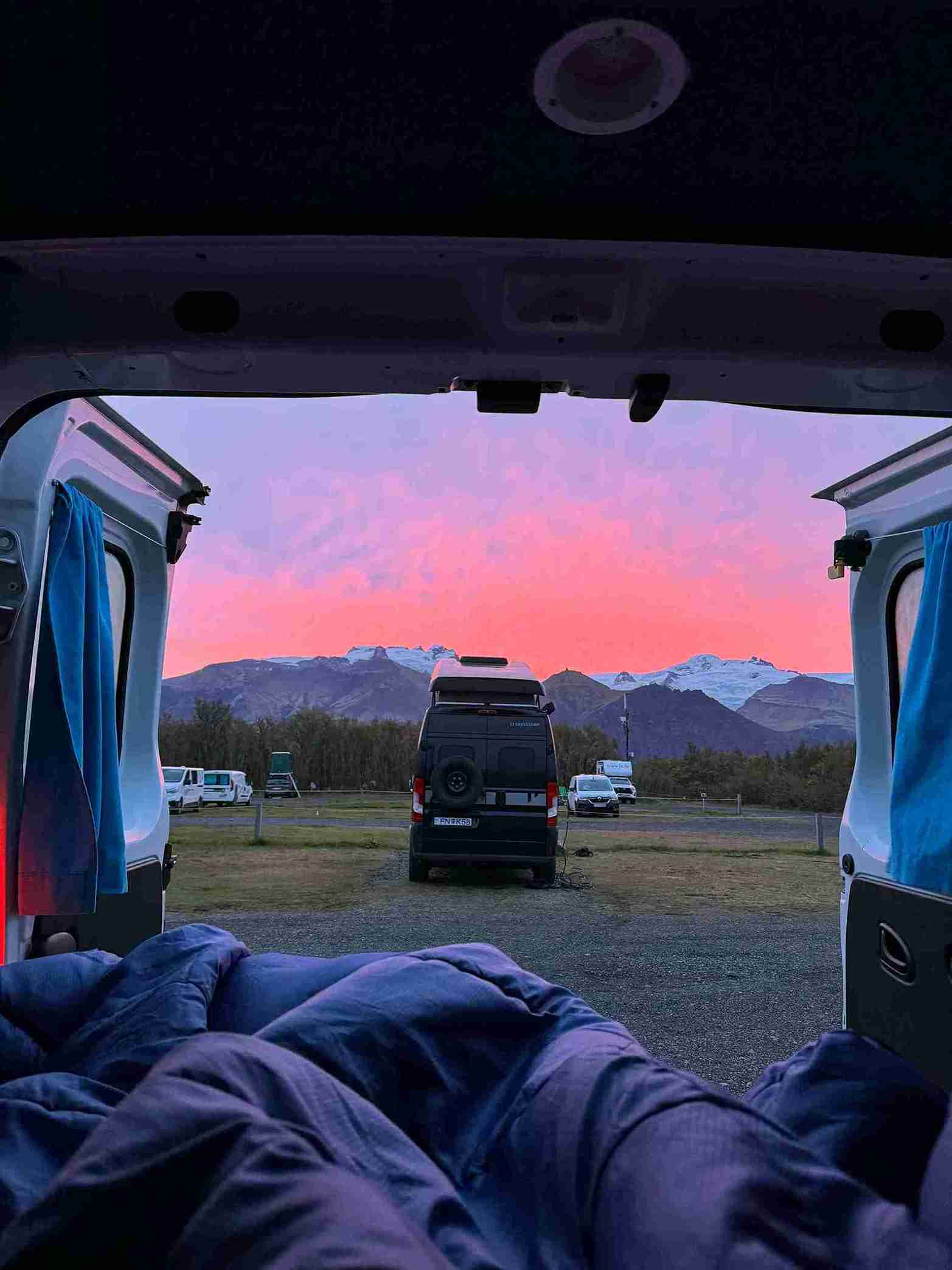 Looking out of a Trafic 3 on to a Crosscamp Flex at a campsite