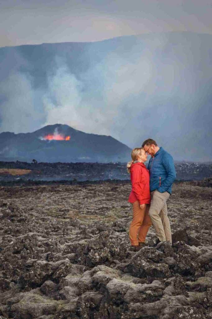 A couple together by a volcano in Iceland